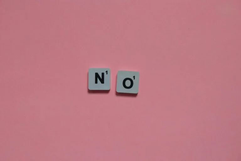 Letters N and O from a word game on a pink background. Minimalist and playful.