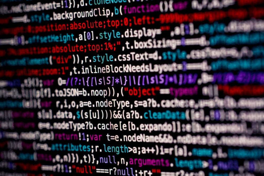 Close-up of multicolored code on a computer screen, highlighting programming.